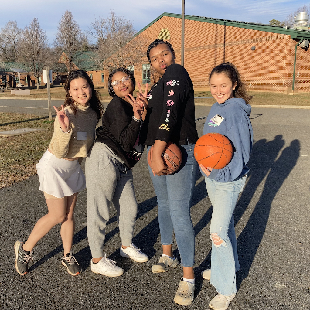 Girls posing with basketballs
