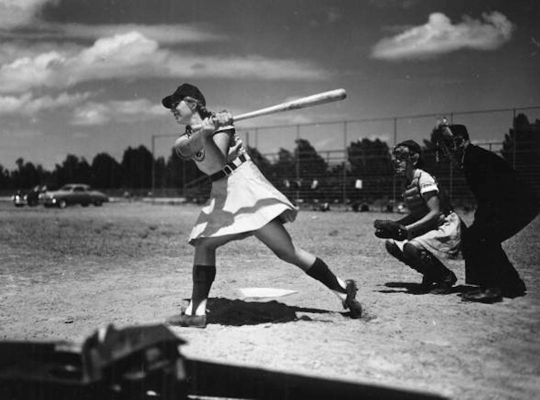<p><span style="font-size:12px"><strong><em>"It's a hit and batter Dottie Schroeder, blonde pigtails and all, start[s] running for first. These girls really hit...and are lightning when running."</em> (April 22, 1948) &nbsp;</strong>Dorothy "Dottie" Schroeder&nbsp;became the All-American Girls Professional Baseball League's youngest player at age 15 and was the only girl who played all 12 seasons for the AAGPBL.</span></p>
