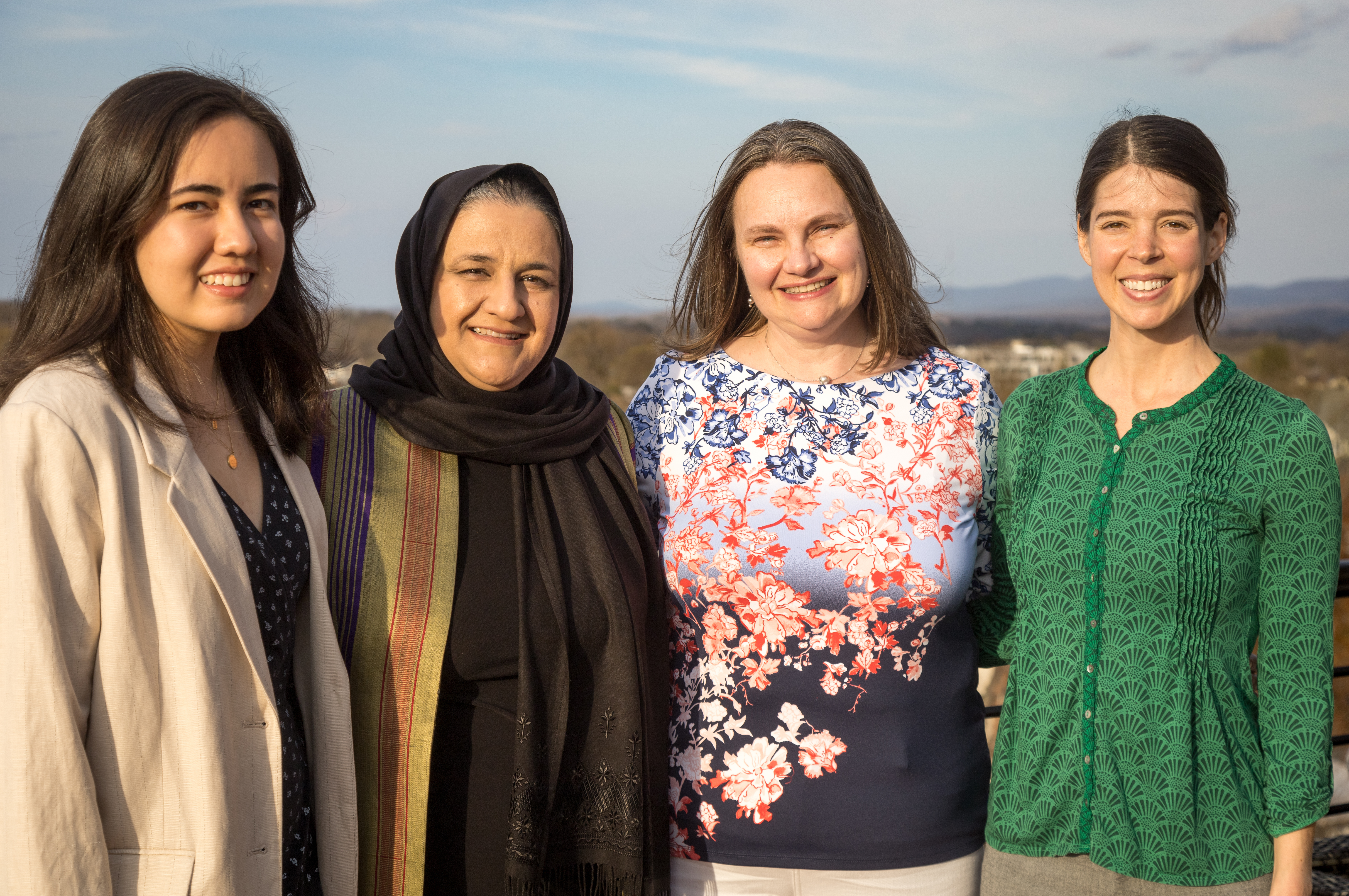 Photo of Rangina Hamidi with Abby Palko and two students 