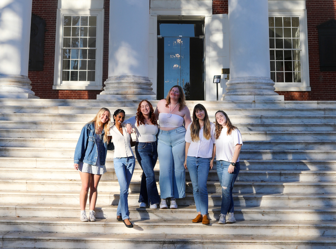 Body Positive Intern team, wearing blue and white, standing on Rotunda steps.