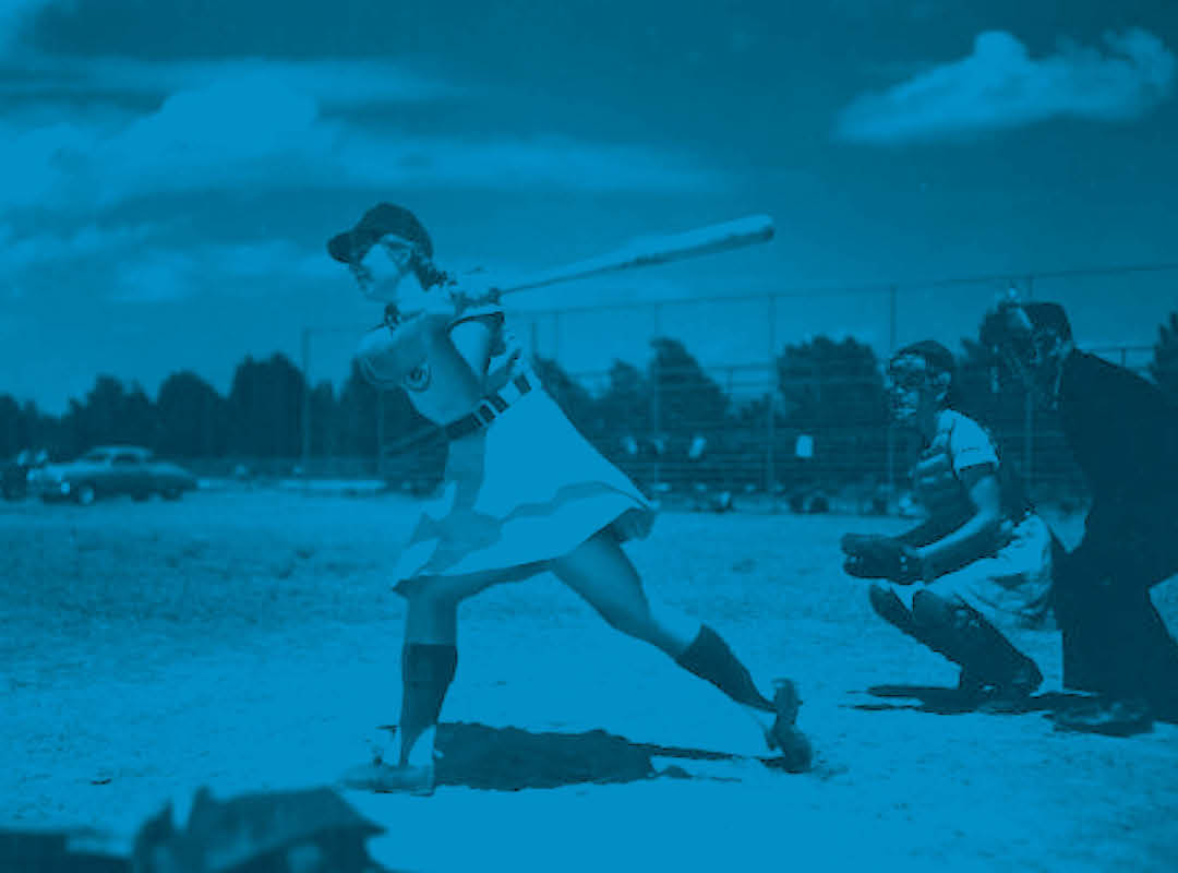 girls professional baseball league player at bat