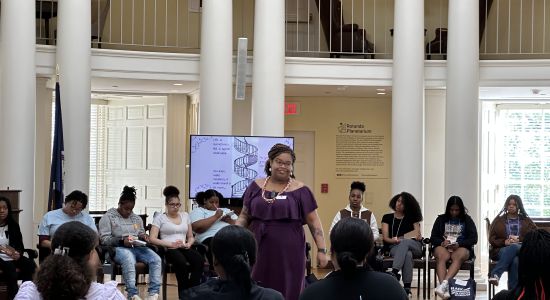 Ti Ames speaking to high school women in the rotunda dome room as part of the Black Women in College Workshop
