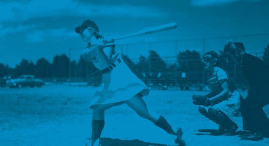girls professional baseball league player at bat