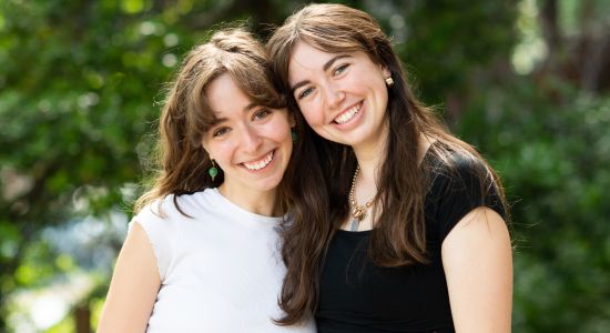 Photo of students Caroline and Noa at 2023 Women's Center graduating students open house.