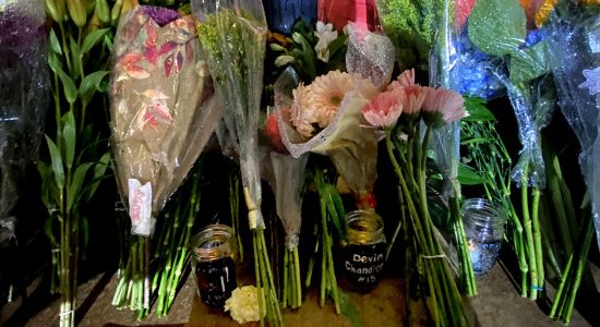 votives and flowers in stadium memorial area